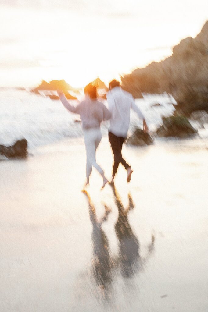 blurred beach engagement photo